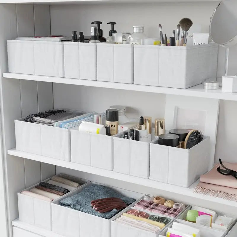Shelves with white storage boxes containing various items in a well-organized room.