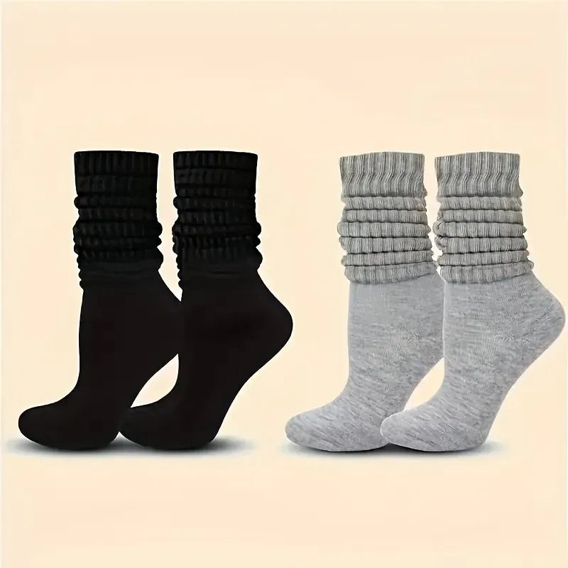 Three pairs of solid-colored black, white, and gray stackable socks, stylish and casual, versatile for various outfits. Peaceful Pleasures Health and Wellness