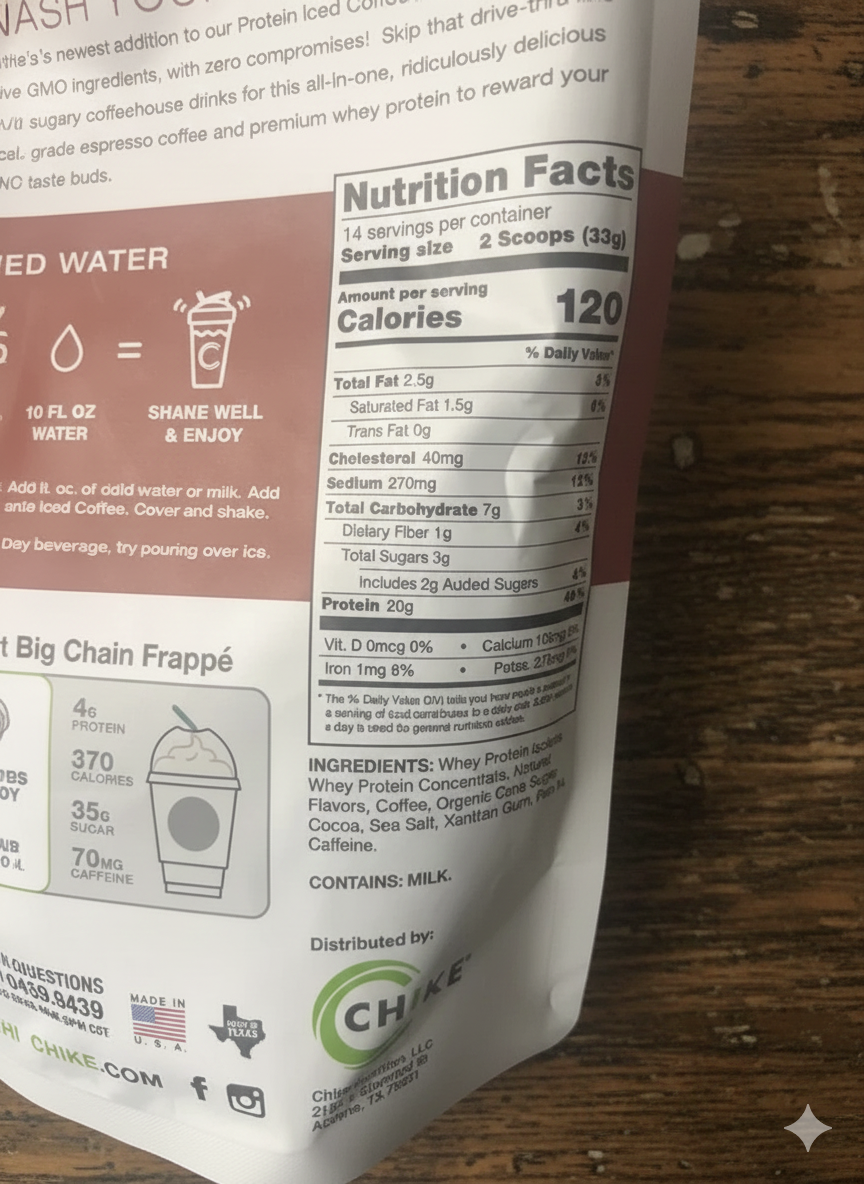 Nutrition facts label on a protein powder package with a wooden surface background