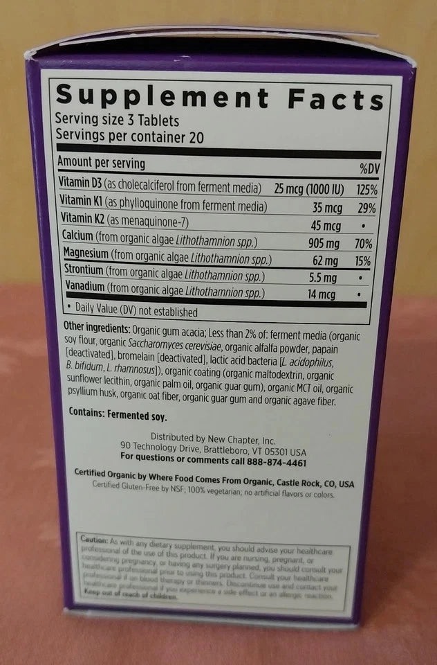 Supplement facts label on a purple and white container
