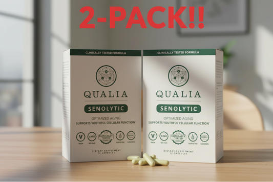 Two boxes of Qualia Senolytic on a table with a blurred background