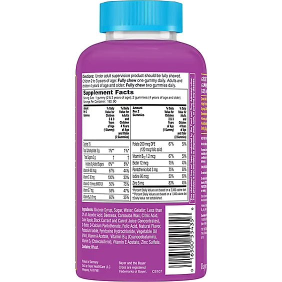 Purple supplement bottle with blue cap on a white background