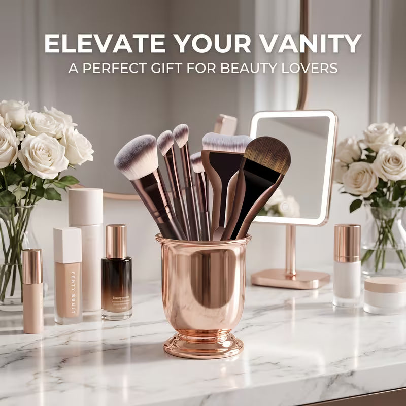 Makeup brushes in a rose gold holder on a vanity with text 'Elevate Your Vanity' and 'A Perfect Gift for Beauty Lovers'.