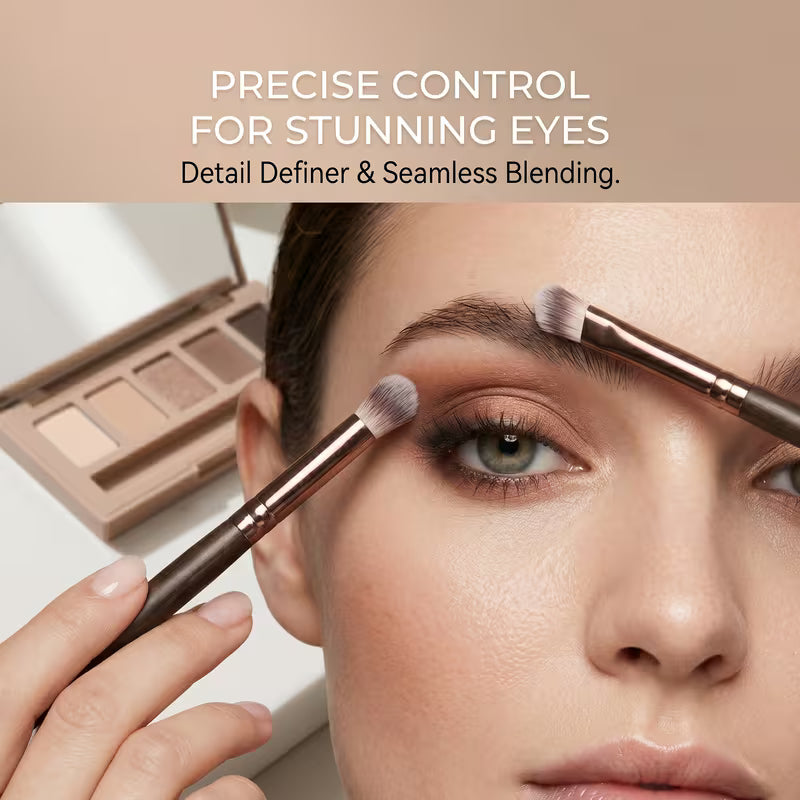Woman applying makeup with brushes and a palette, emphasizing precise control for stunning eyes.