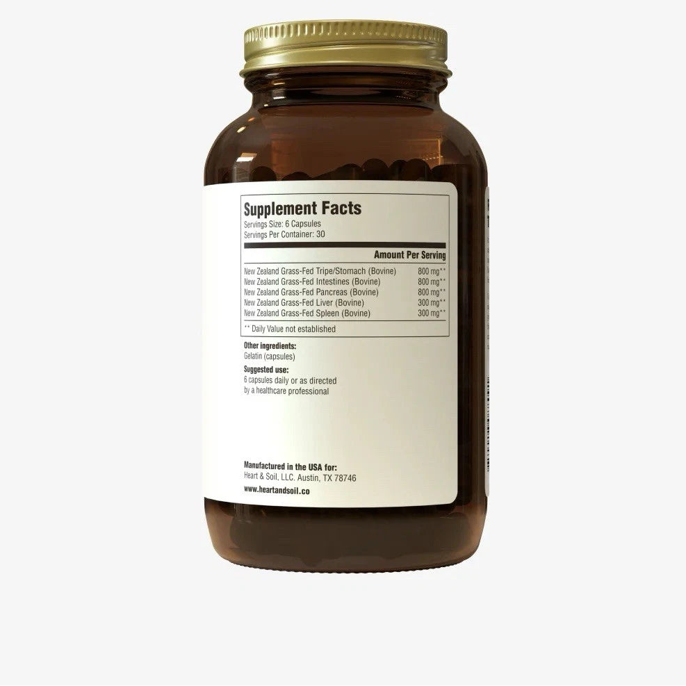 Brown supplement bottle with gold cap on a white background