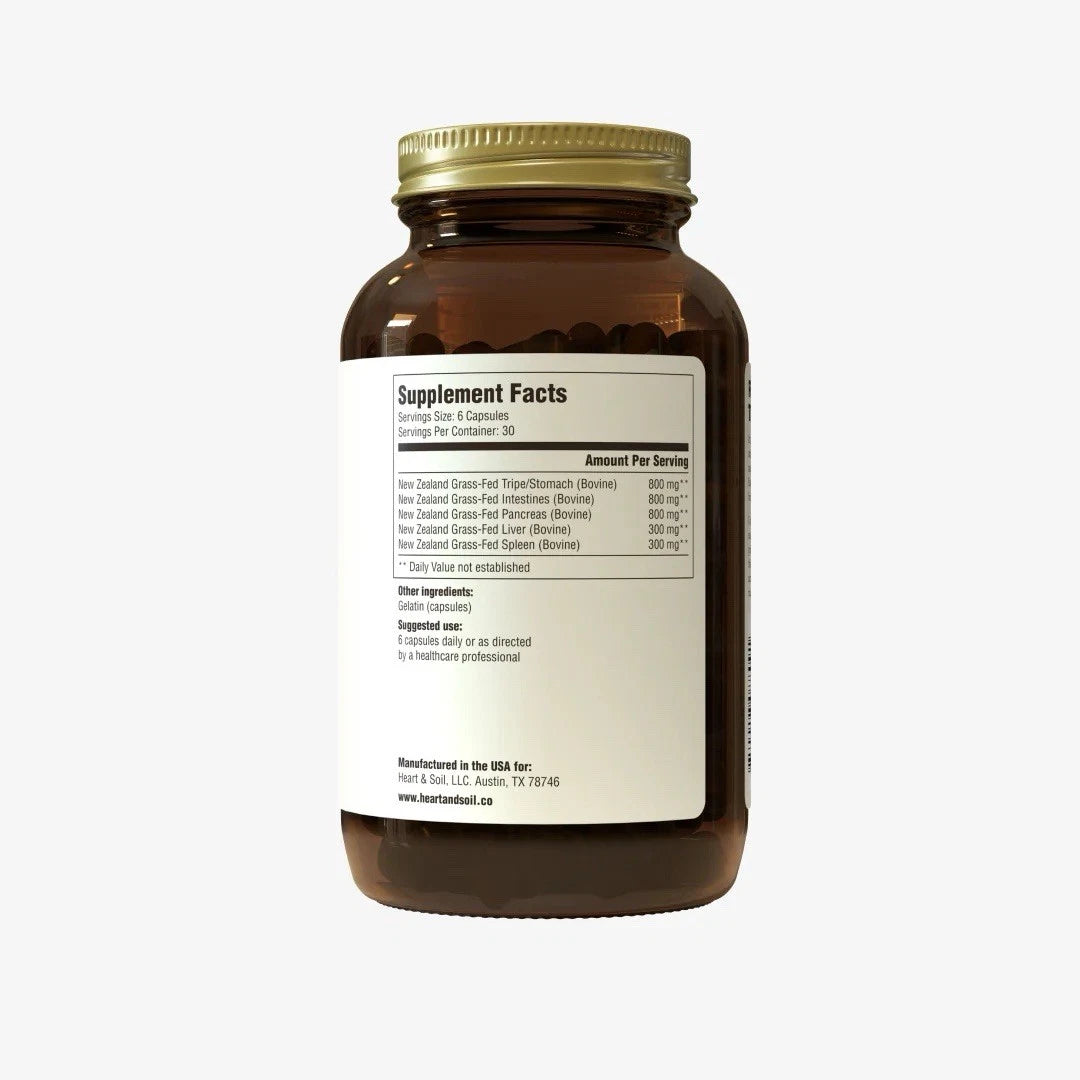Brown supplement bottle with gold cap on a white background