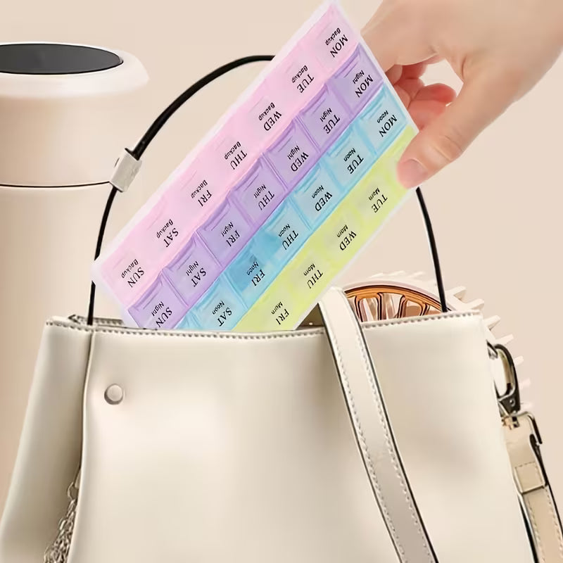 Colorful weekly pill organizer being placed into a beige handbag.