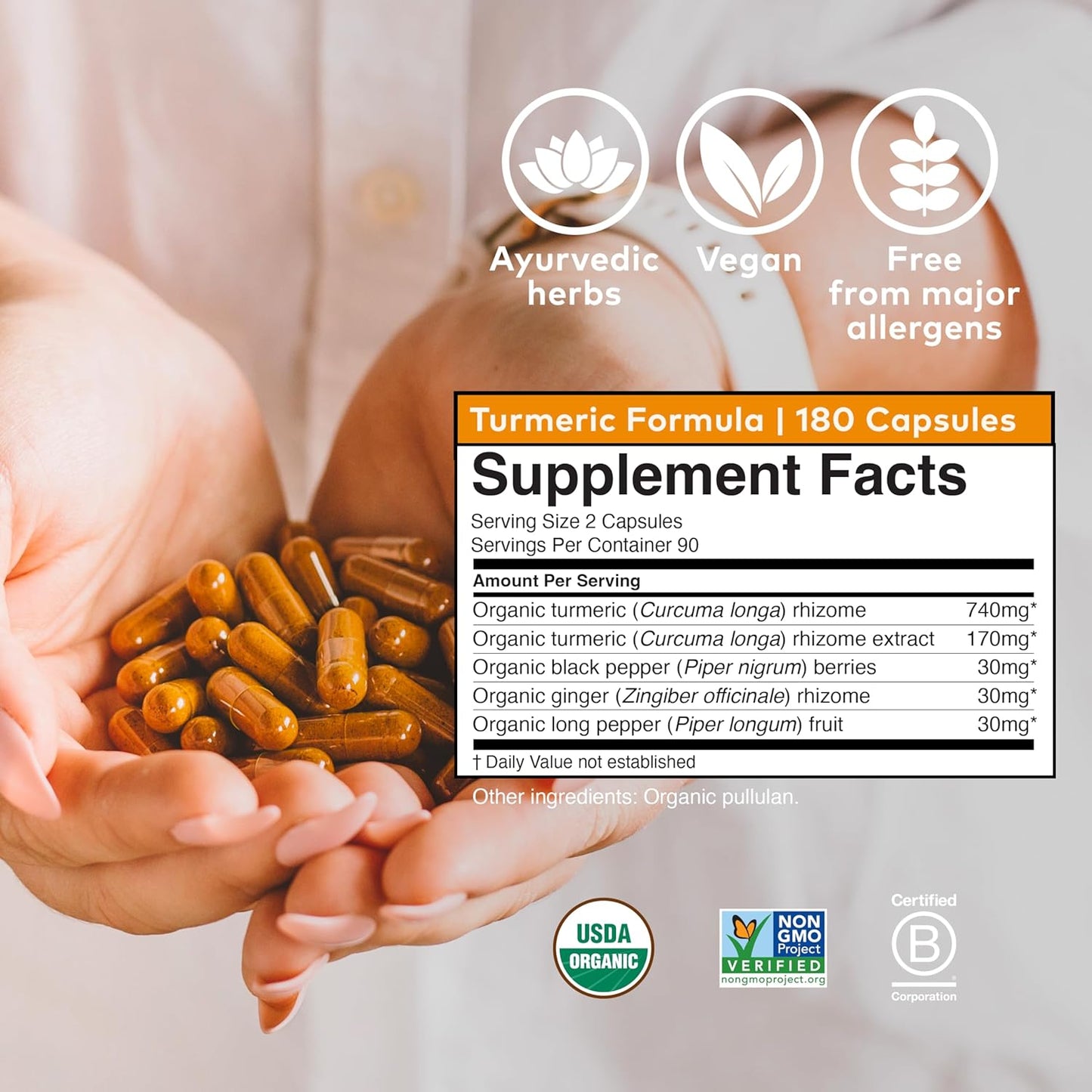 Supplement packaging with turmeric capsules and certification logos on a white background