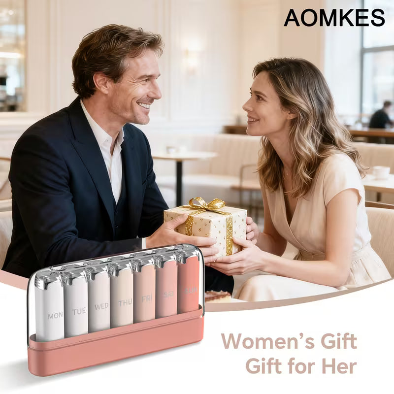 Man and woman in a cafe with a gift box, AOMKES branding visible.