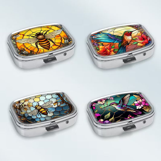 Four decorative pill boxes with colorful mosaic designs on a light gray background