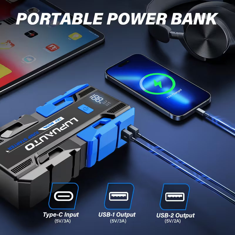 Portable power bank with smartphone and headphones on a dark surface