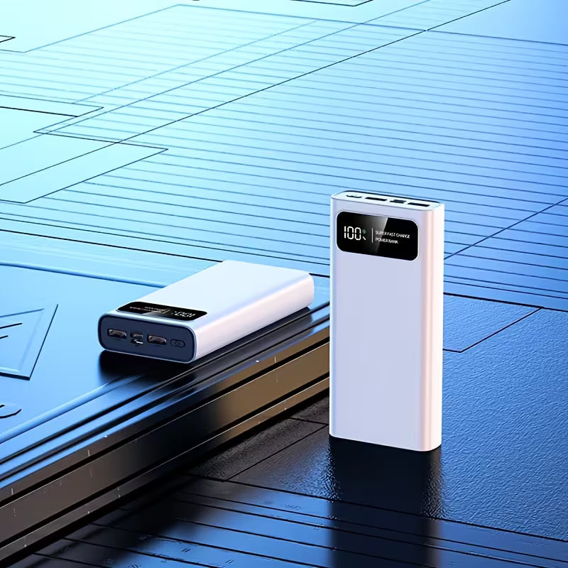 White power bank with digital display on a blue surface