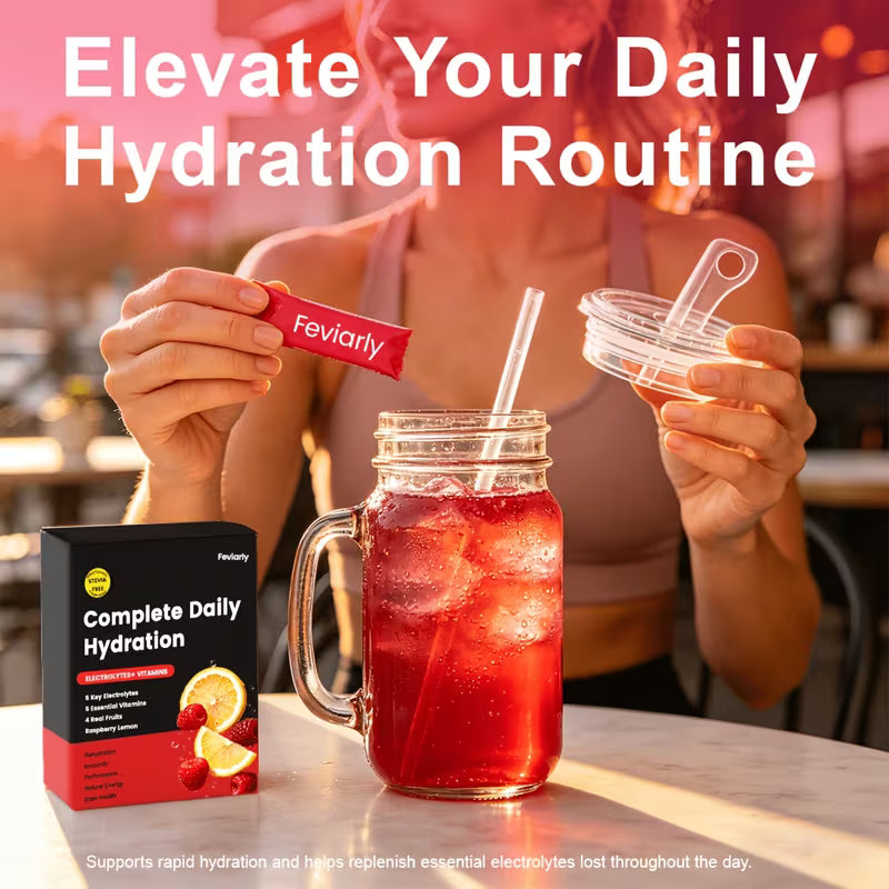 Person holding a Fevilyr hydration packet with a drink and packaging on a table.