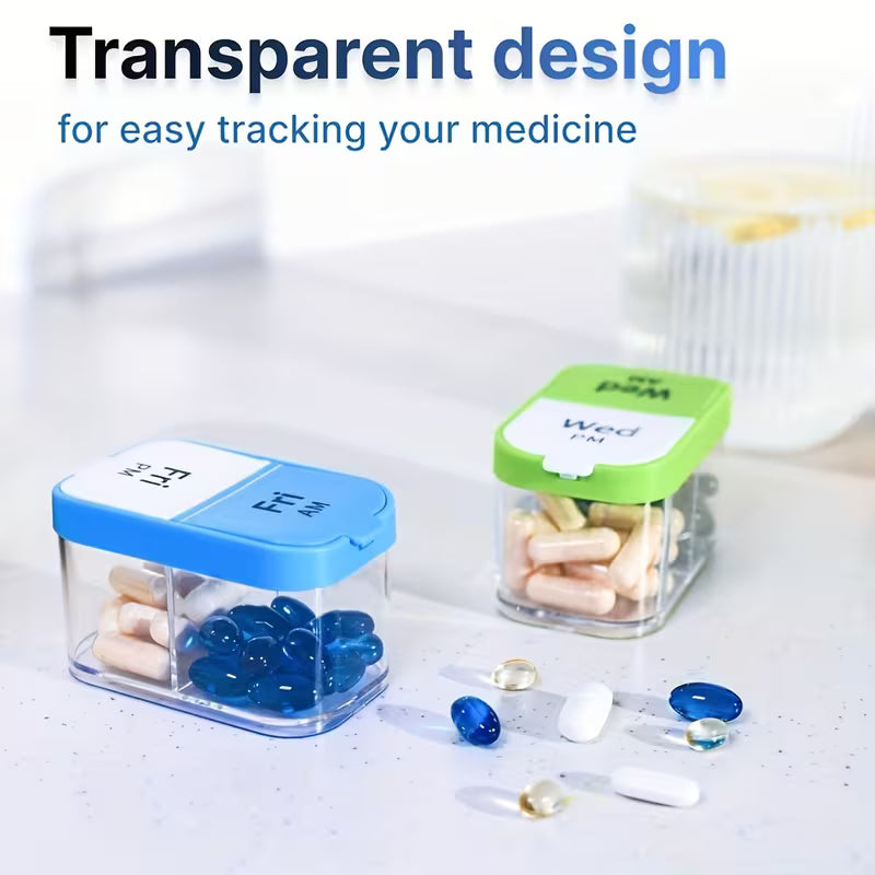 Transparent pill containers with labeled lids on a white surface, featuring blue and green lids.