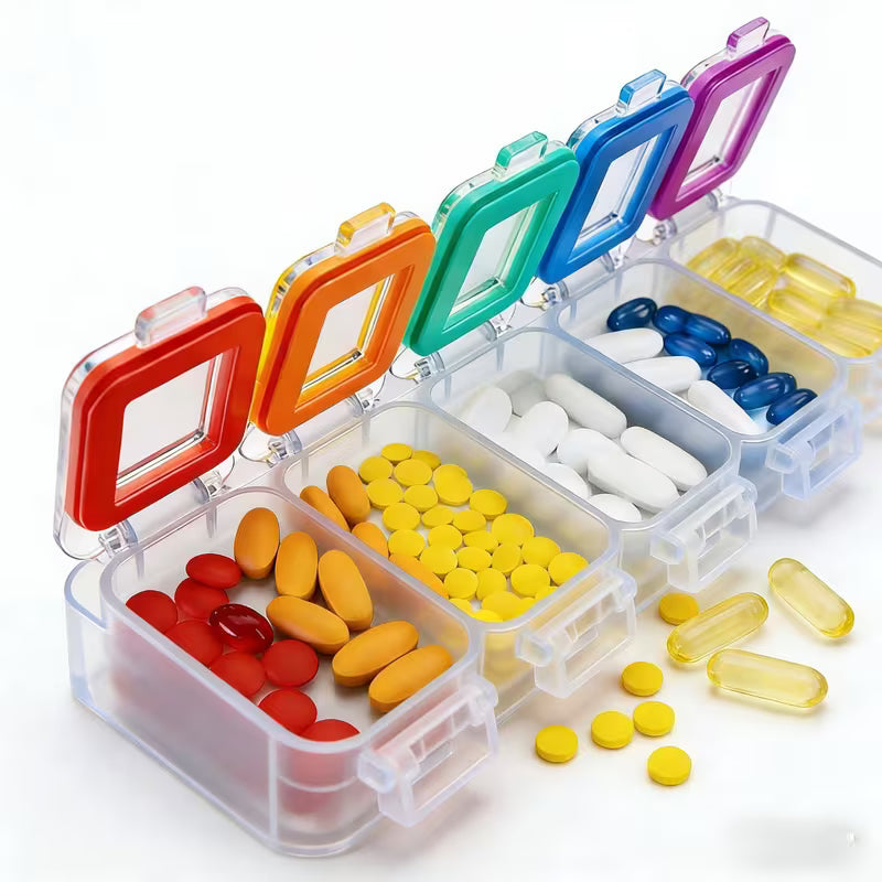Colorful pill organizer with various medications on a white background