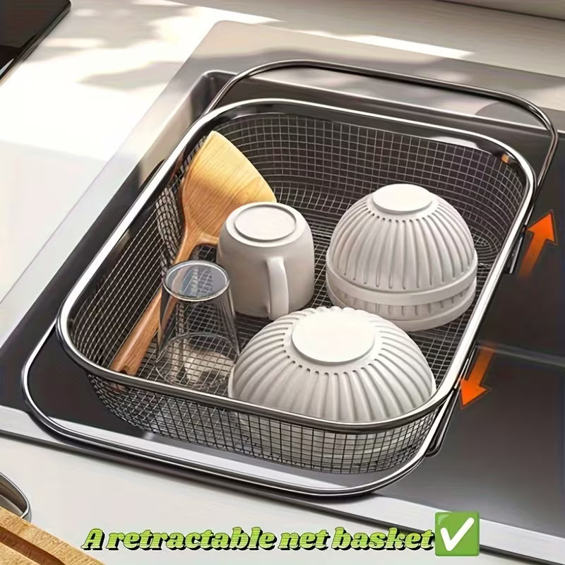 Retractable net basket in a kitchen sink with utensils and dishes.