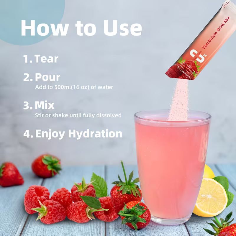 Strawberry drink mix being added to a glass with strawberries and lemon on a wooden surface.