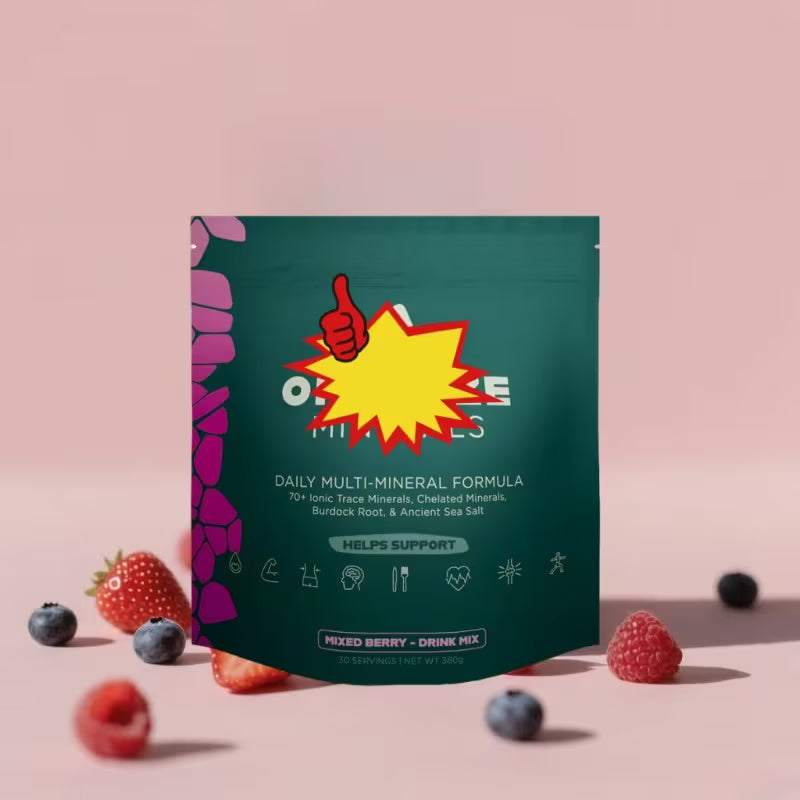 Multimineral formula package with berries on a pink background