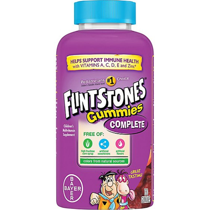 Purple bottle of Flintstones Gummies Complete supplement with blue cap on a white background