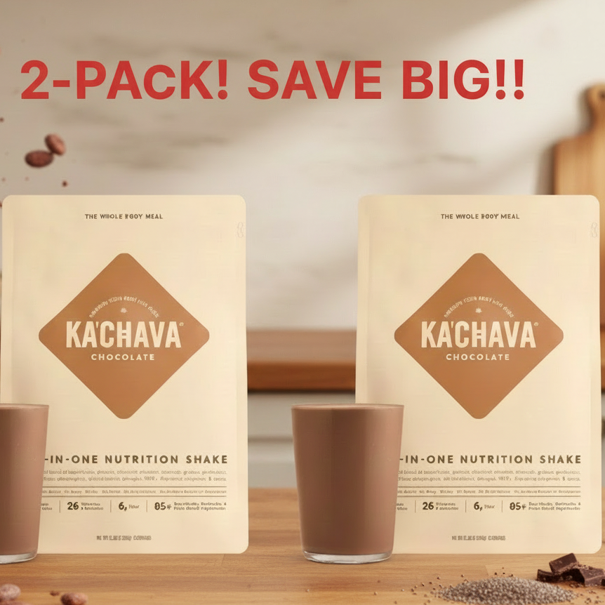 Two Kachava chocolate nutrition shake packages with a cup on a wooden surface.