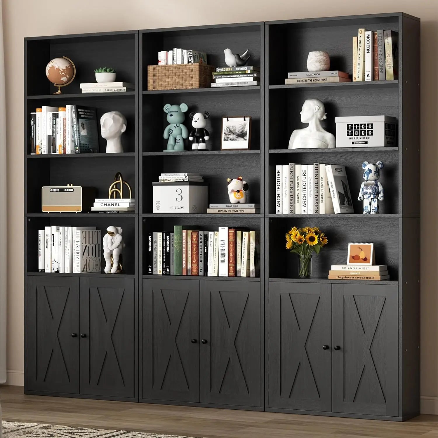 Black bookshelf with decorative items against a beige wall