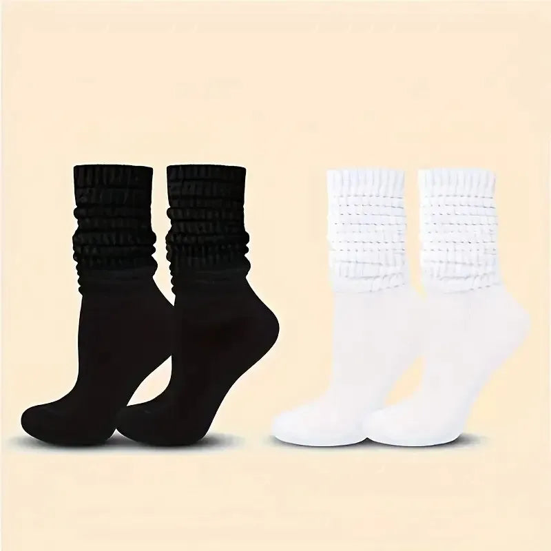 Three pairs of solid-colored black, white, and gray stackable socks, stylish and casual, versatile for various outfits. Peaceful Pleasures Health and Wellness
