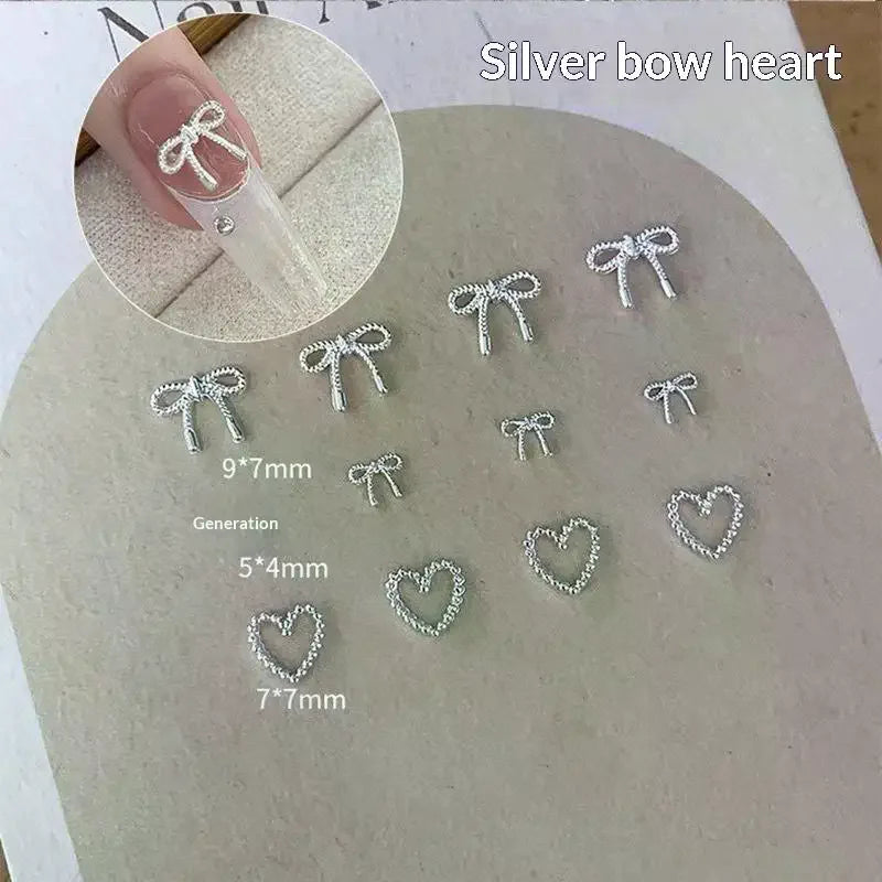 100Pcs 3D Silver Small Bowkont Heart-shaped Ornaments Nail Art Decorations Supplies DIY Alloy Bow Heart Nail Charms Accessories Peaceful Pleasures Health and Wellness