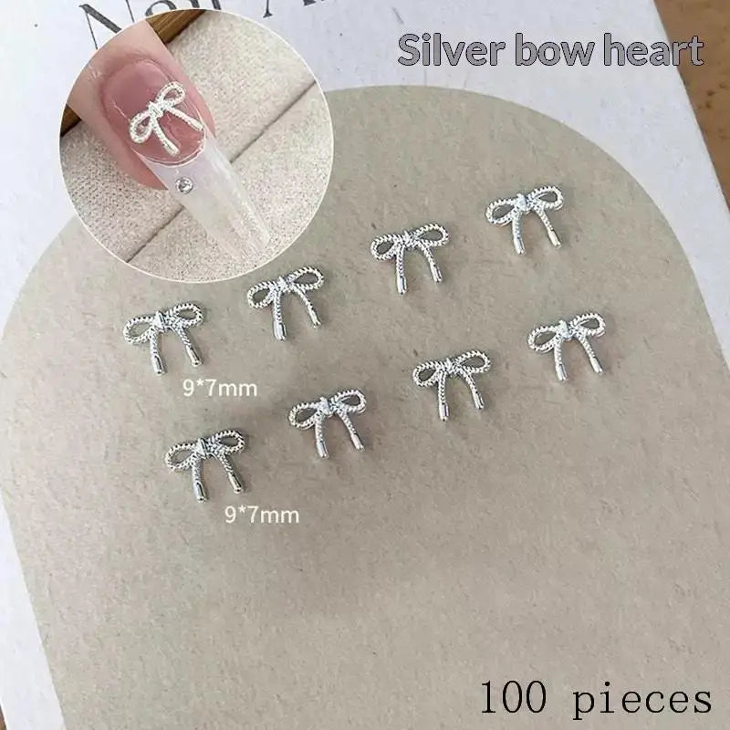 100Pcs 3D Silver Small Bowkont Heart-shaped Ornaments Nail Art Decorations Supplies DIY Alloy Bow Heart Nail Charms Accessories Peaceful Pleasures Health and Wellness A1