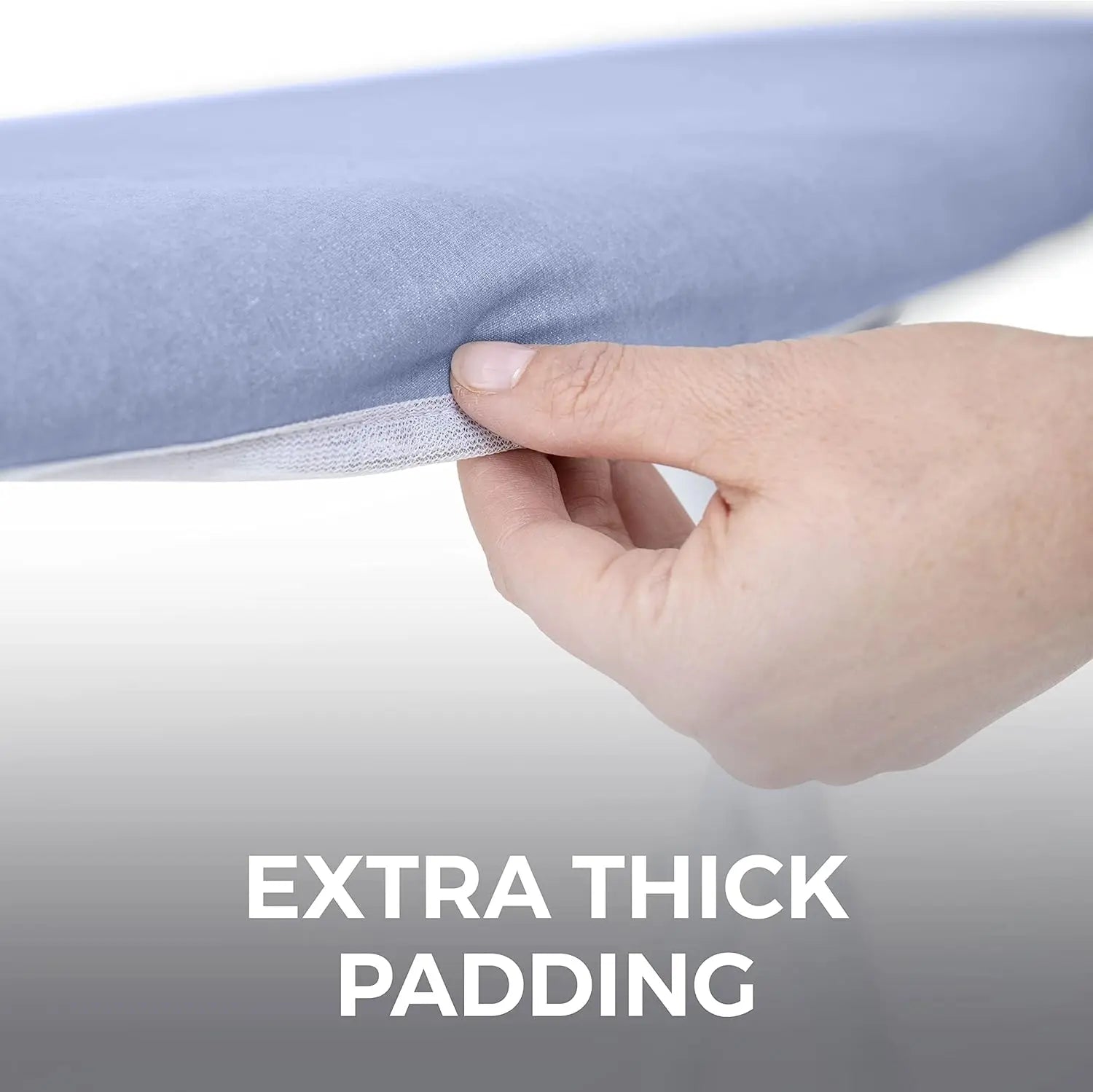 Hand holding a strip of extra thick padding with a light blue background