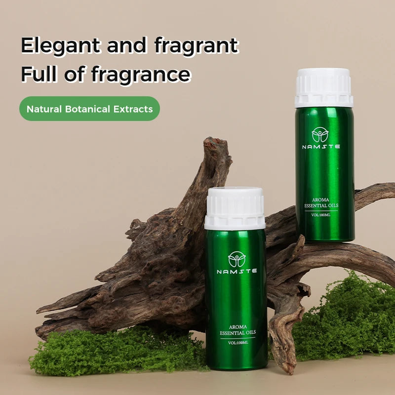Green essential oil bottles with white caps on a natural background