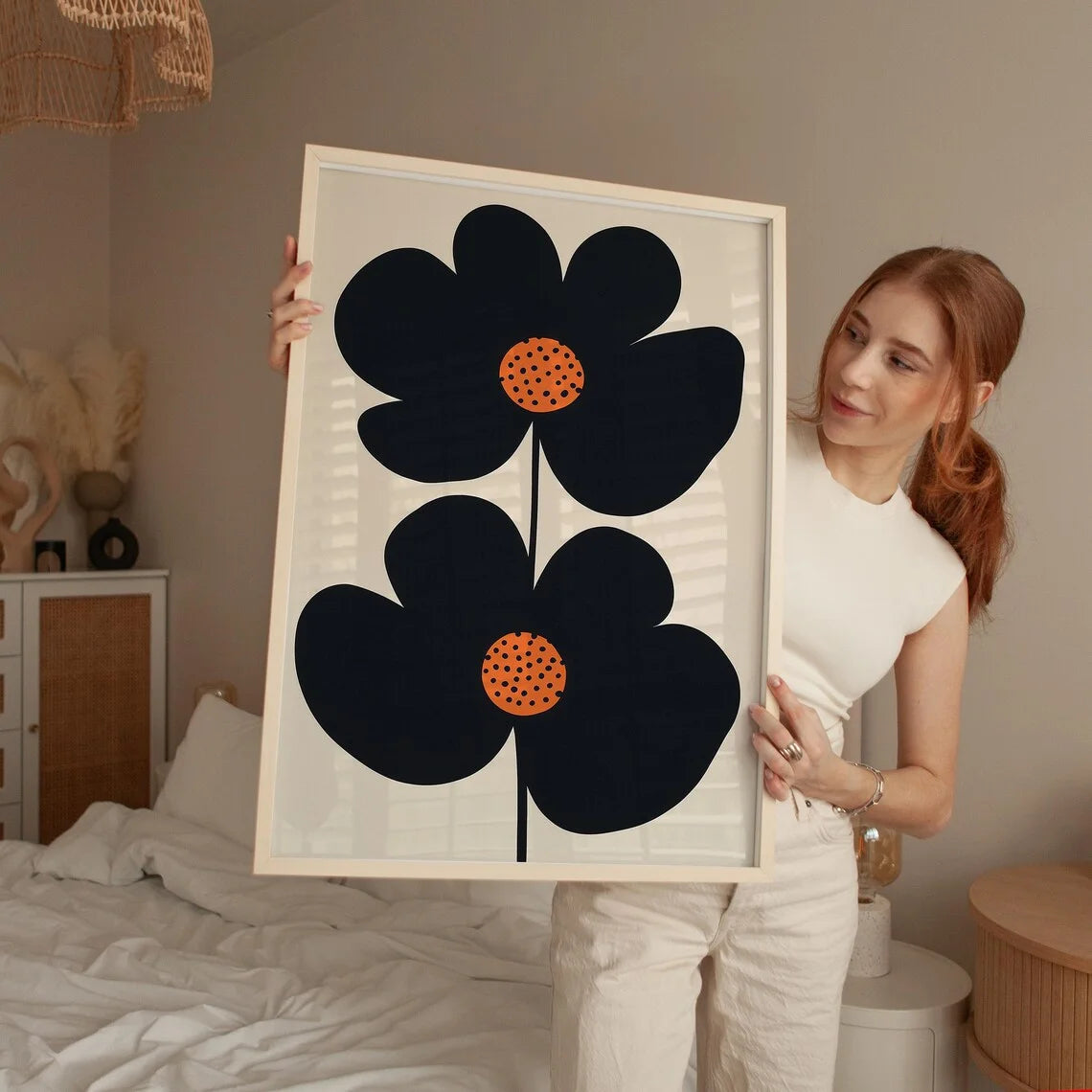 "Mid-Century Modern Minimalist Floral Art Print: Bold Black Double-Flower Design with Playful Orange Polka-Dot Centers, Perfect Peaceful Pleasures Health and Wellness