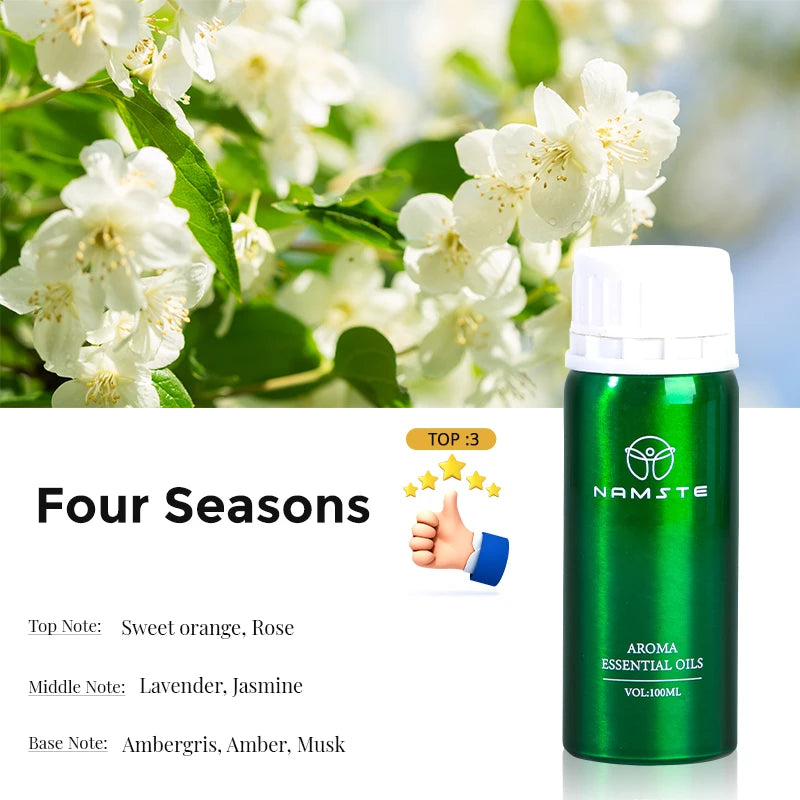 Green essential oil bottle with white cap on a background of white flowers and green leaves, featuring the brand 'Namste'.