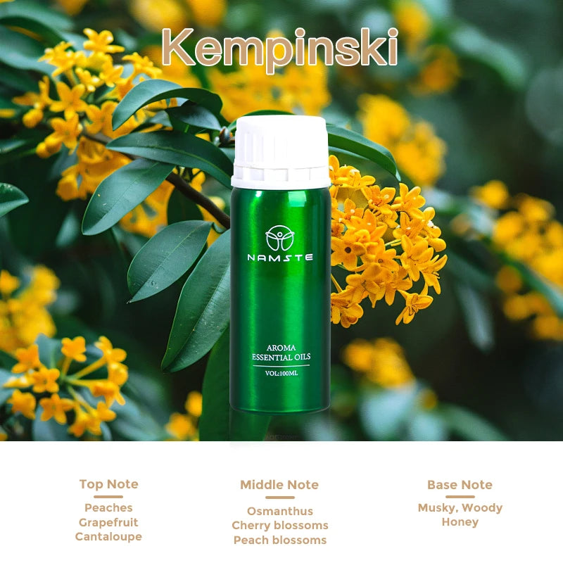 Green essential oil bottle with yellow flowers and 'Kempinski' branding