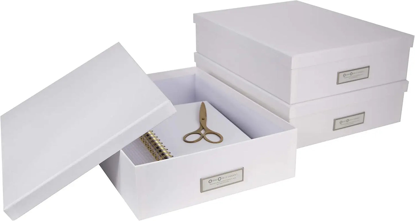 Set of white storage boxes with jewelry inside on a white background