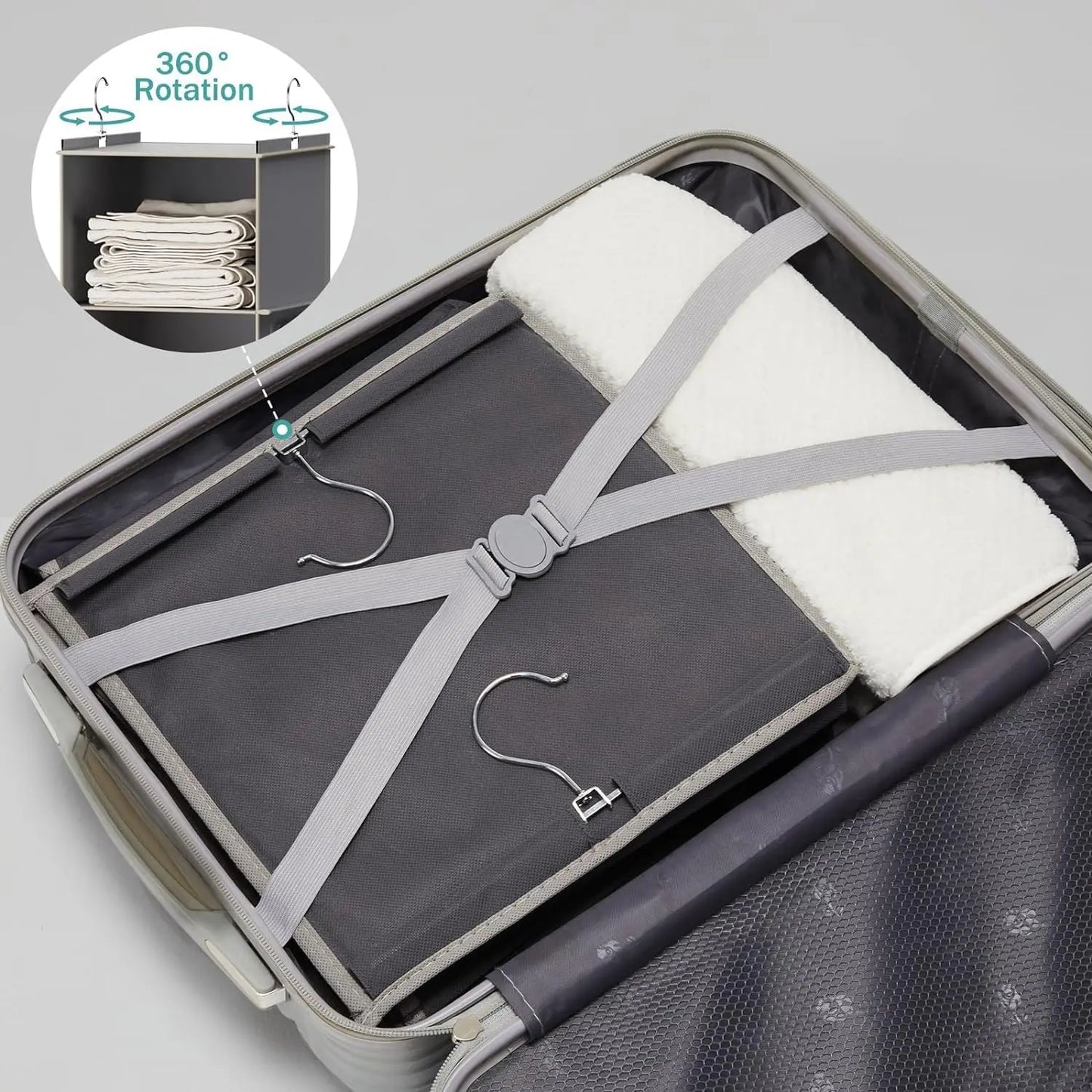 Foldable travel mat with hangers and straps in an open suitcase, showing 360-degree rotation feature.