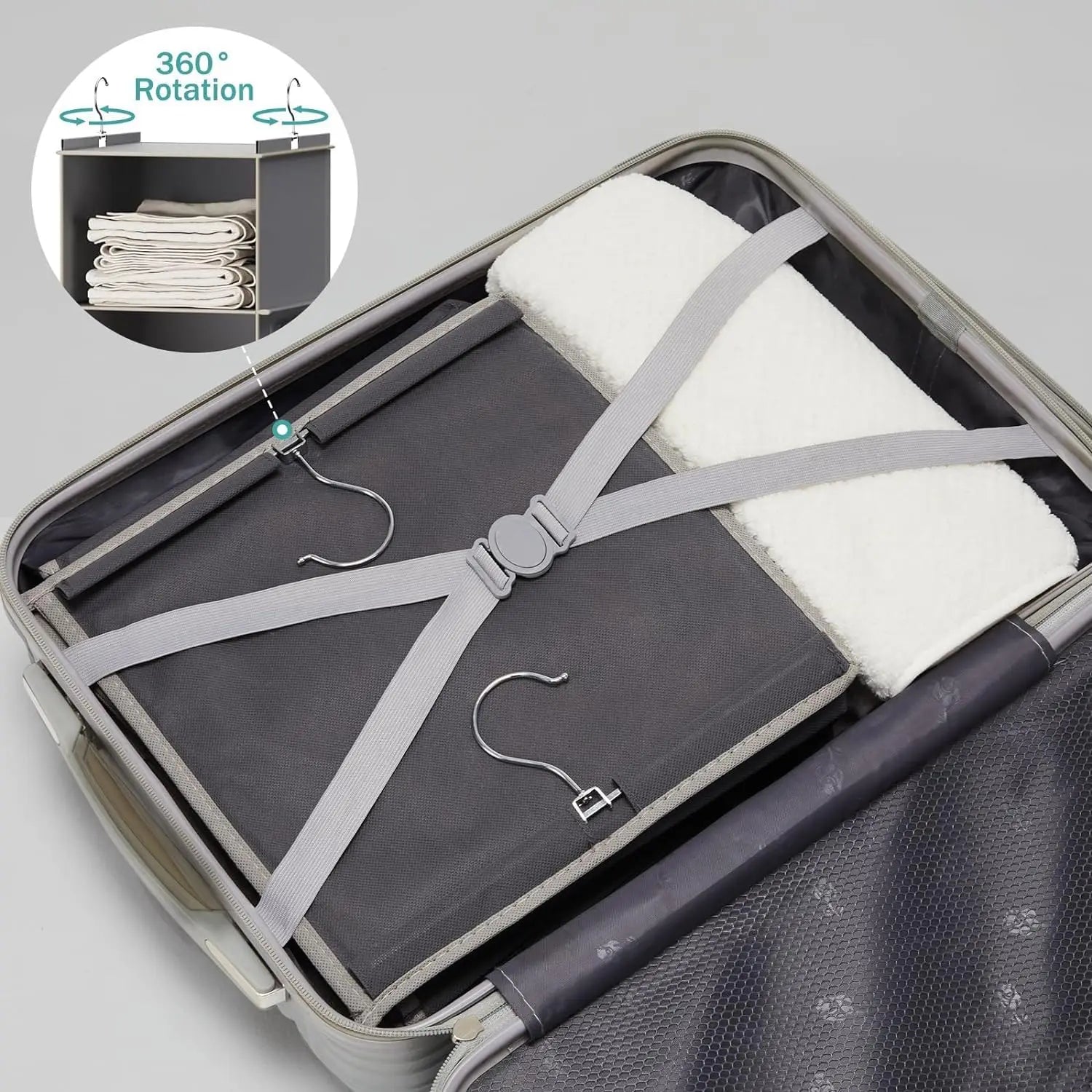Foldable travel mat with hangers and straps in an open suitcase, showing 360-degree rotation feature.