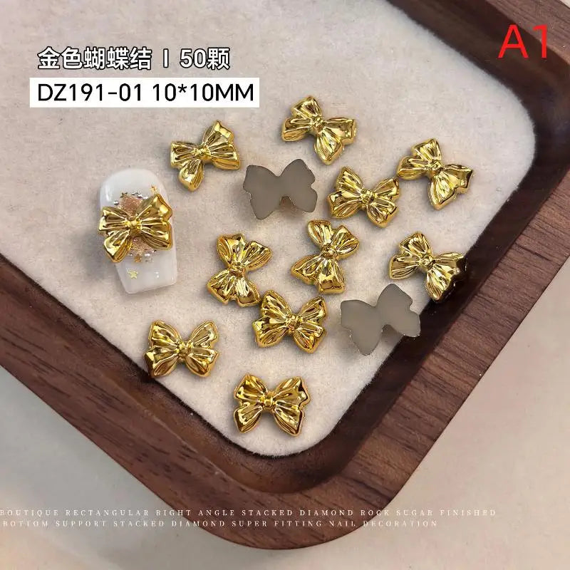 50pcs Gold Silver Brief French Bow Tie Bowknots Ribbon Resin Nail Art Rhinestones Decorations Manicure Imitation Metal Charms Peaceful Pleasures Health and Wellness A1
