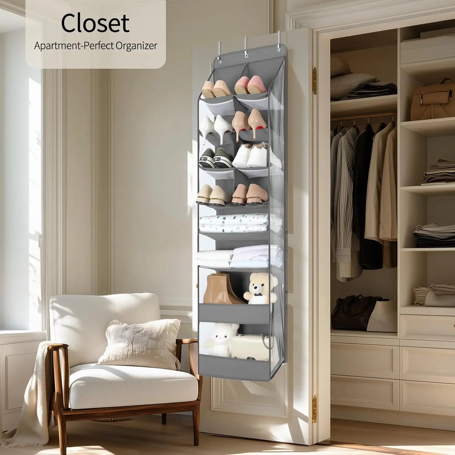 Closet organizer hanging on a door with shoes and clothes inside, next to a chair and wardrobe.