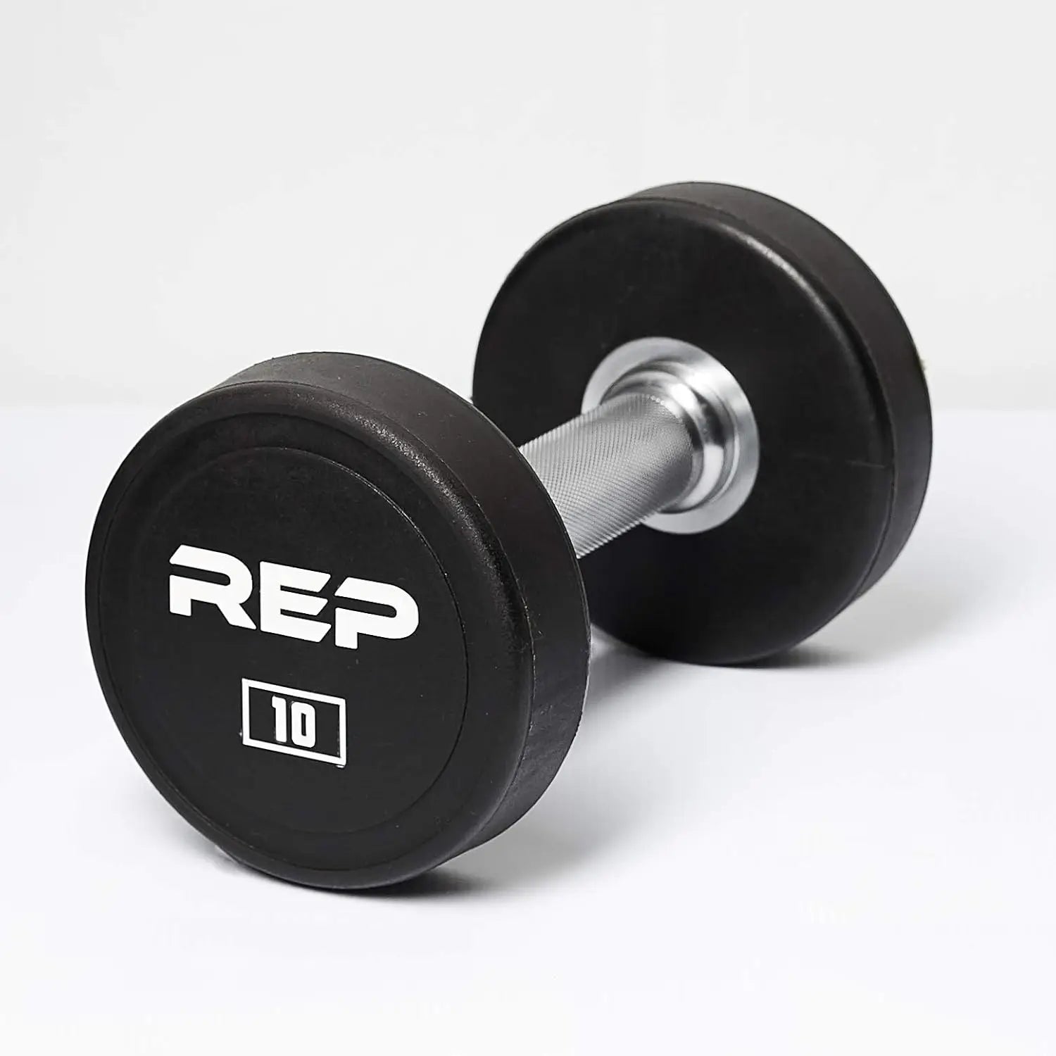Pair of black dumbbells with 'REP' branding on a white background