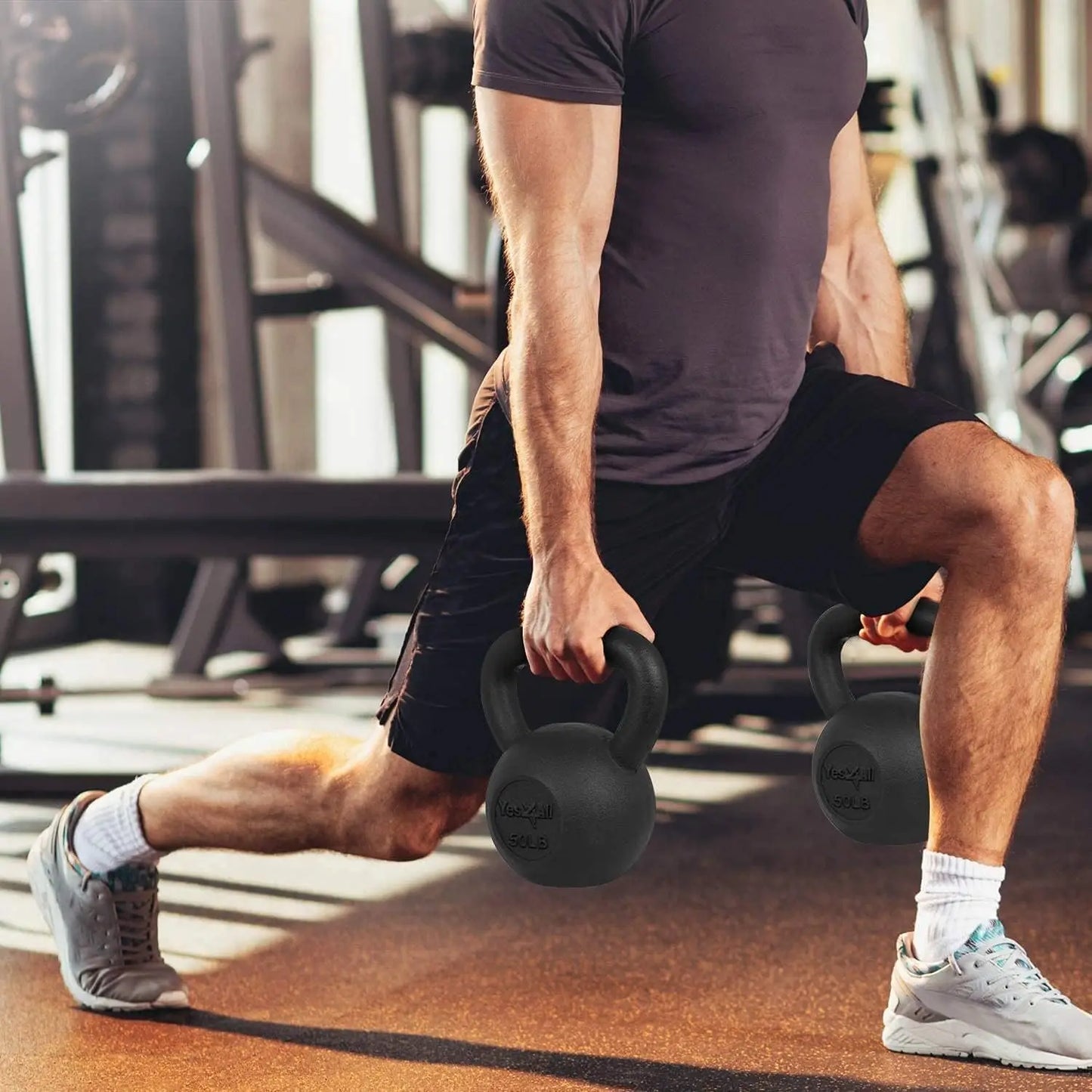 Person performing a kettlebell exercise in a gym setting