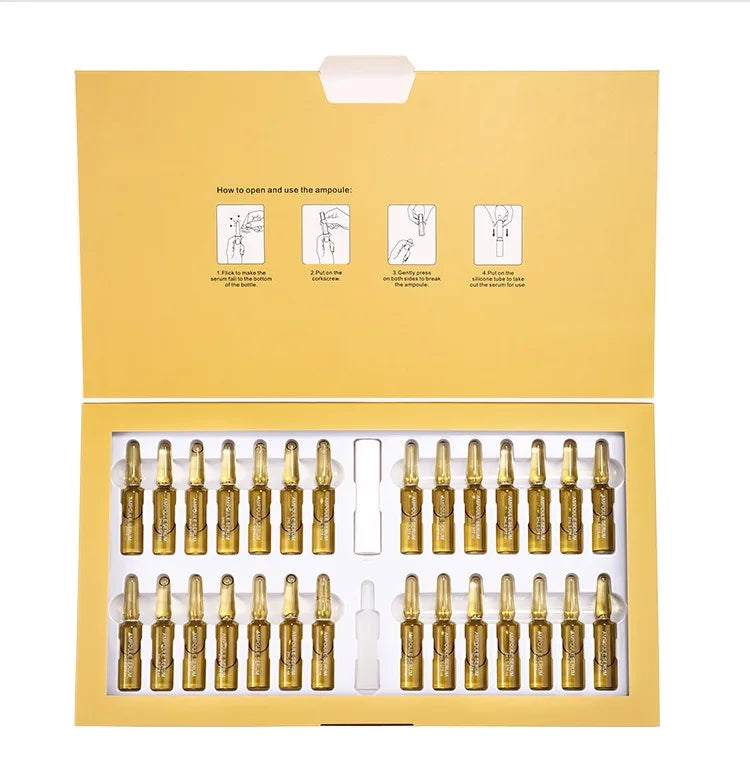 Set of gold ampoules in a yellow box with usage instructions.