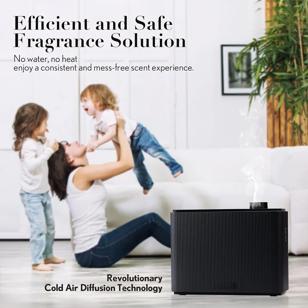 Woman playing with two children in a living room with an air diffuser on the floor.