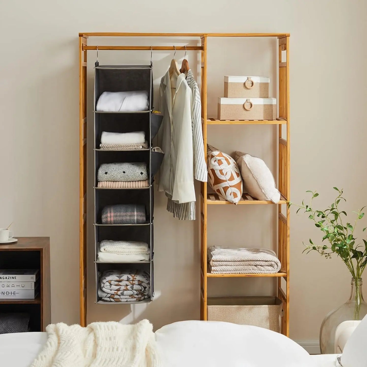 Wooden wardrobe with shelves and clothes in a room setting