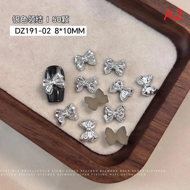 50pcs Gold Silver Brief French Bow Tie Bowknots Ribbon Resin Nail Art Rhinestones Decorations Manicure Imitation Metal Charms Peaceful Pleasures Health and Wellness A2