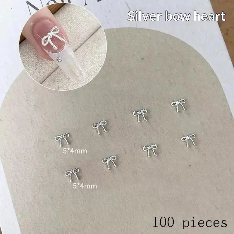 100Pcs 3D Silver Small Bowkont Heart-shaped Ornaments Nail Art Decorations Supplies DIY Alloy Bow Heart Nail Charms Accessories Peaceful Pleasures Health and Wellness A2