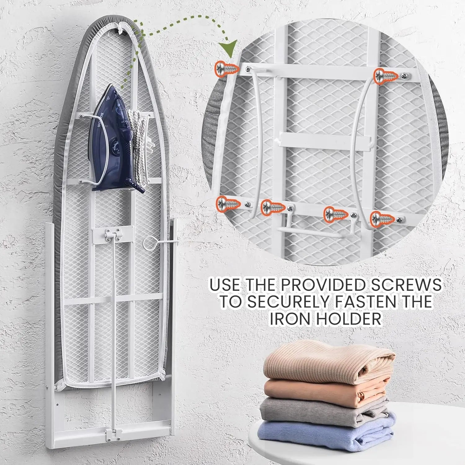 Wall-mounted ironing board with iron holder and screws, stacked folded clothes on a white surface.