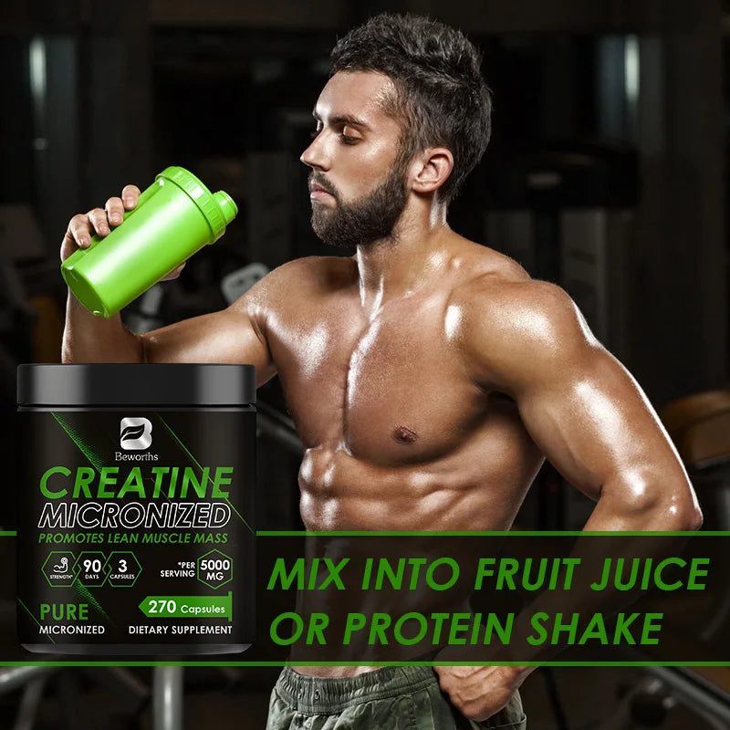 Muscular man holding a green supplement bottle with a creatine supplement container in the foreground.