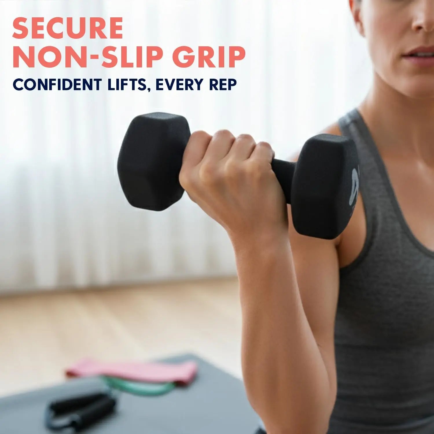 Person holding a black dumbbell with text about secure non-slip grip