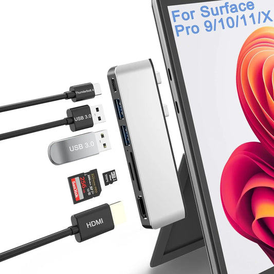 Hub with multiple ports and cables in front of a tablet displaying 'For Surface Pro 9/10/11/X'.
