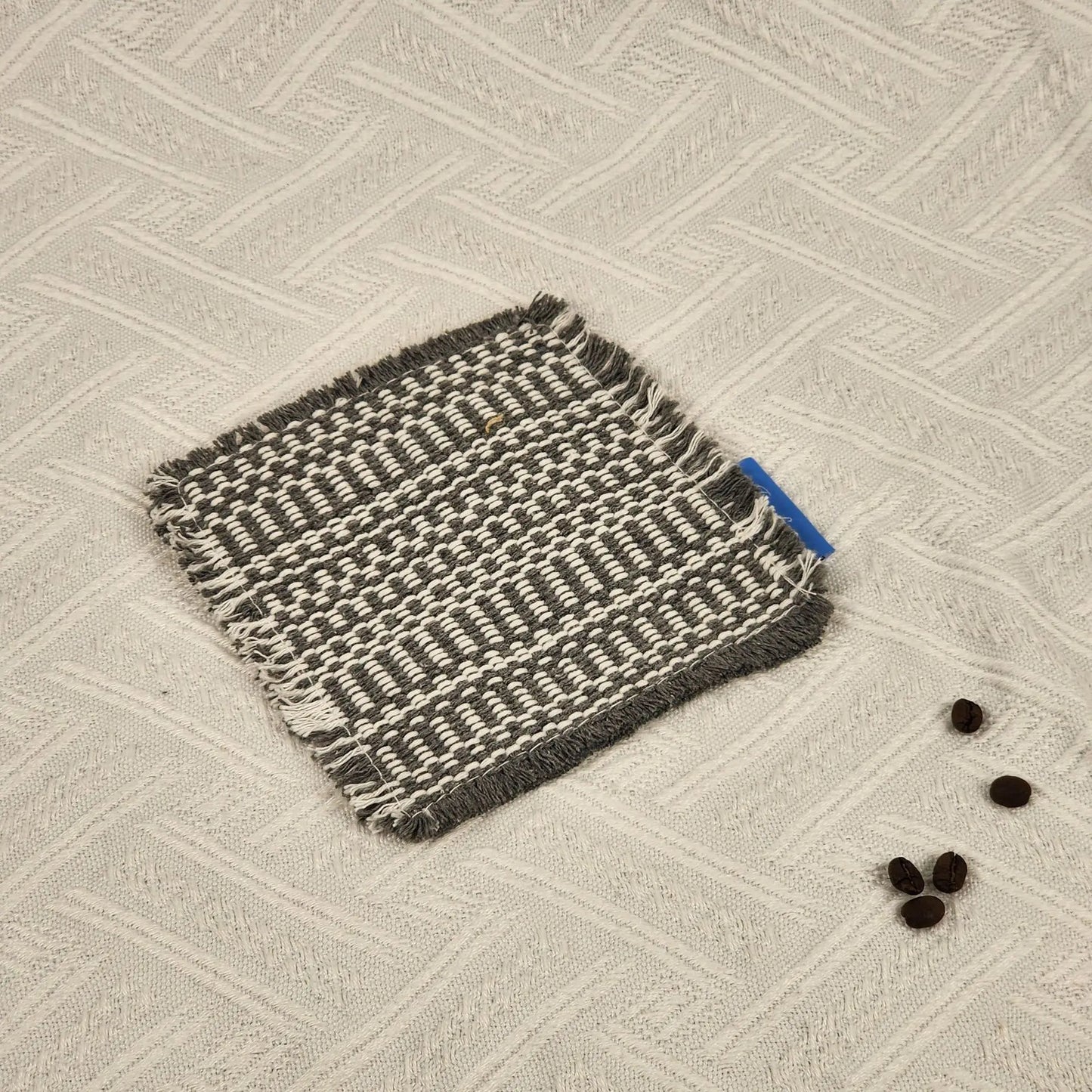 Vintage-inspired, tassel-trimmed woven coasters. checkered square fabric trivets, perfect for coffee, tea, and more Peaceful Pleasures Health and Wellness Gray